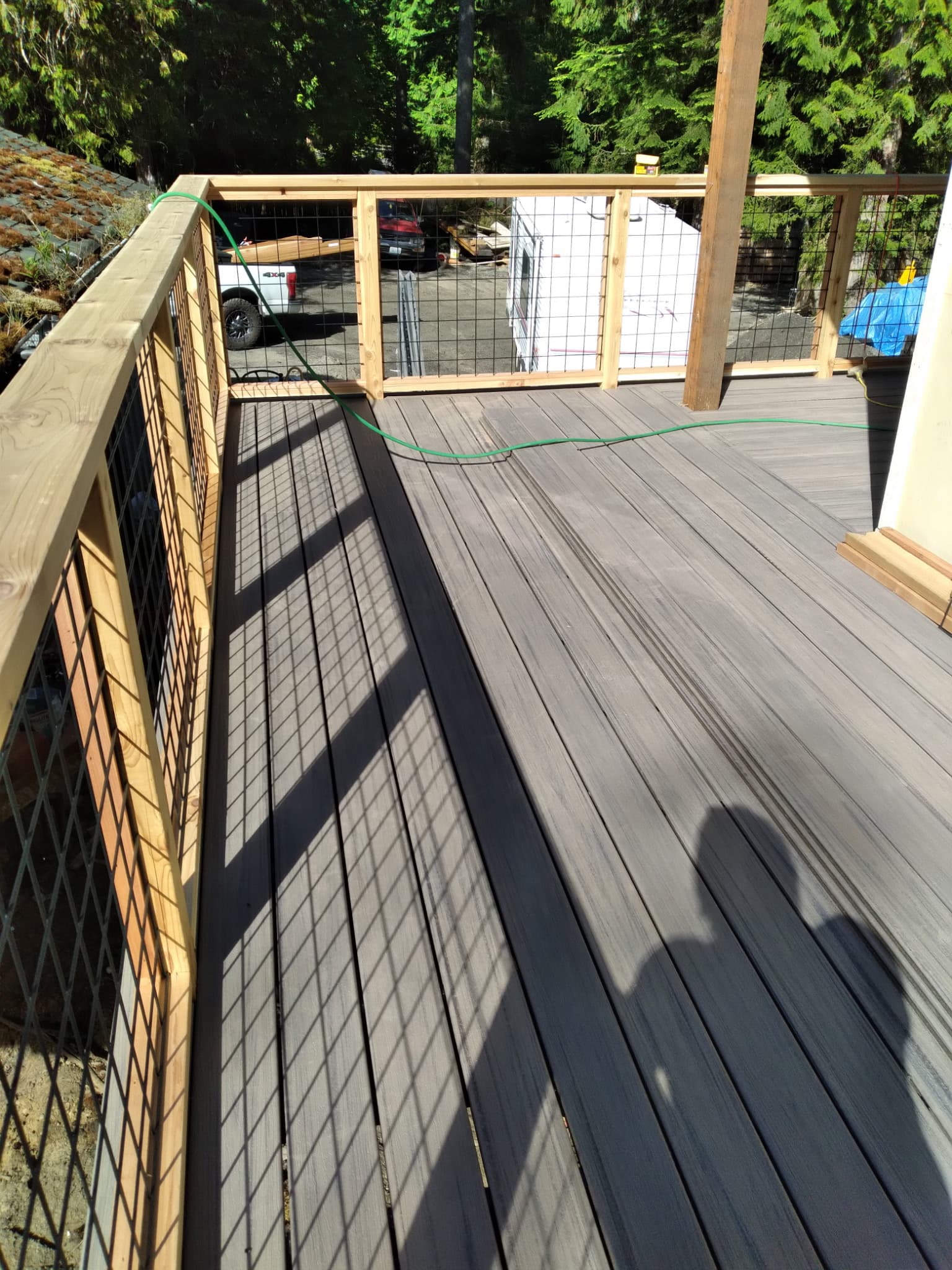 Overhead view of composite deck with wire mesh railing in Pacific Northwest